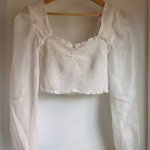 White smocked long sleeve crop top